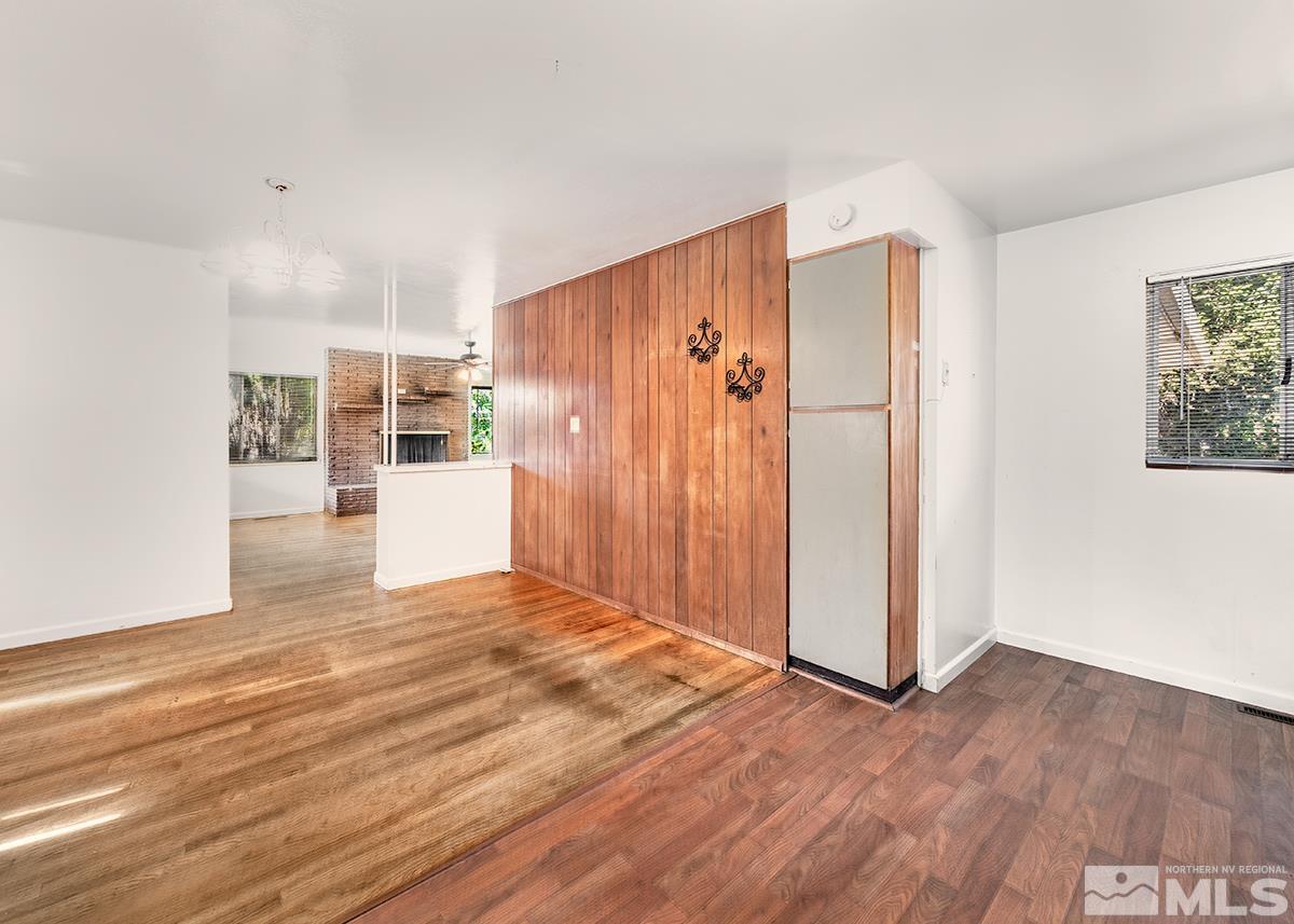 735 Brookfield Drive Reno, NV 89503 - Photo 7 of 23 a view of a kitchen with wooden floor and a refrigerator