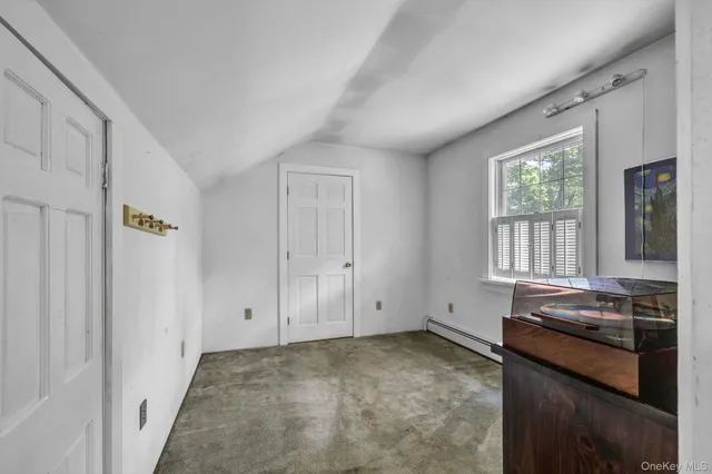 a view of a kitchen with a sink dishwasher and wooden floor