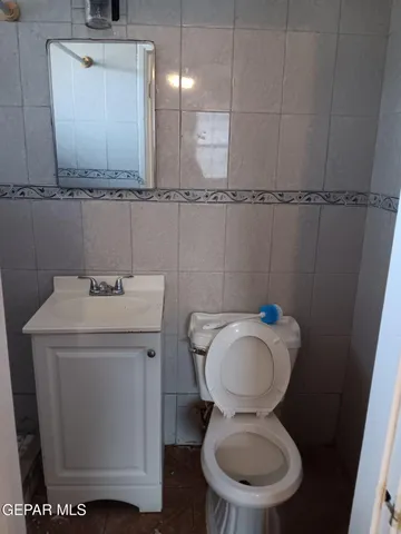 a bathroom with a sink a mirror and a shower