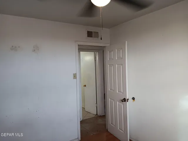 a bathroom with a toilet a sink and a mirror