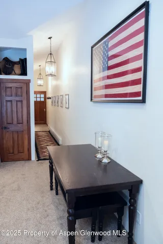 a room with a table chairs and a dining table