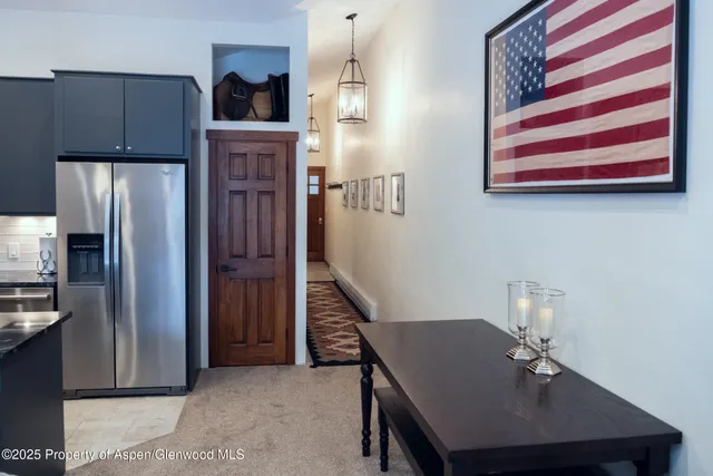 a room with cabinets and stainless steel appliances