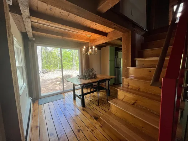 a view of a patio with wooden floor and outdoor seating