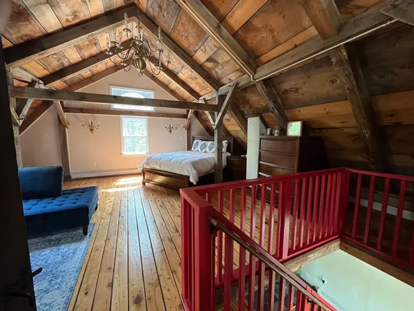 a view of a porch with wooden floor