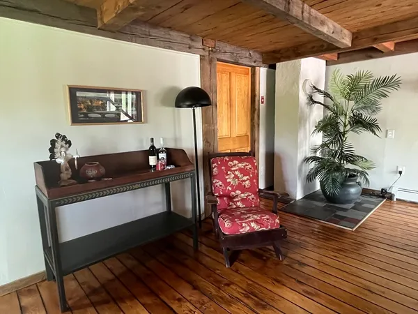 a living room with furniture and flowers