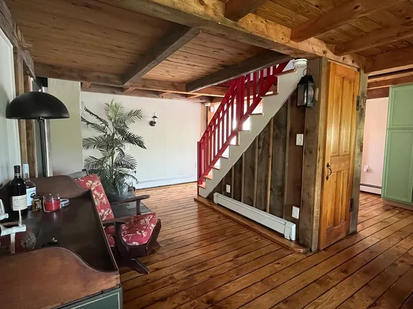 a view of entryway with wooden floor