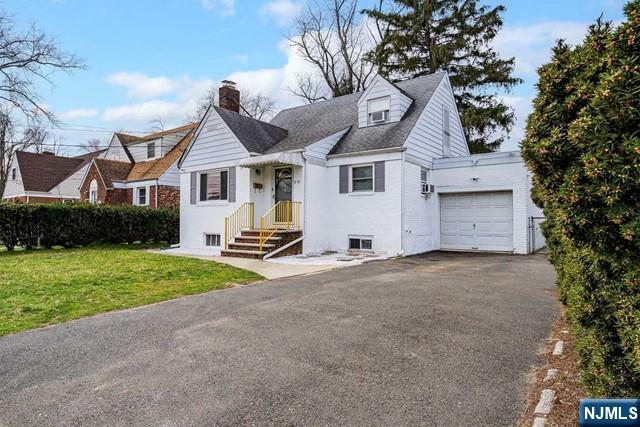 2-10 Saddle River Road Fair Lawn, NJ 07410 - Photo 1 of 20 a view of a house with a yard and garage