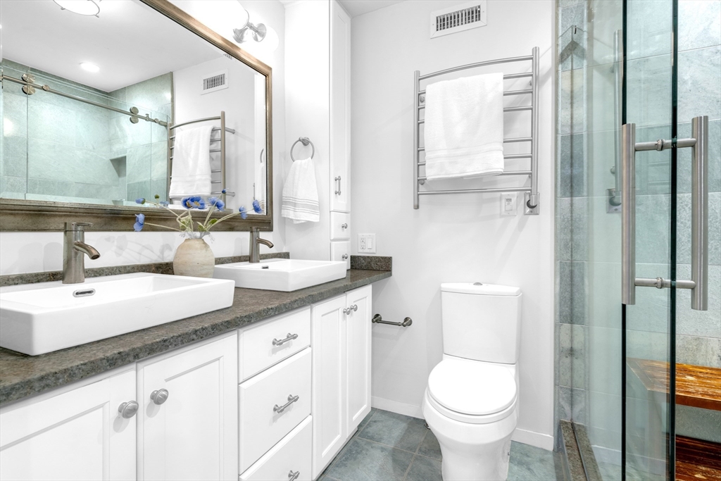 72 Rutland Street, Unit 1 Boston, MA 02118 - Photo 15 of 29 a bathroom with a toilet sink and mirror