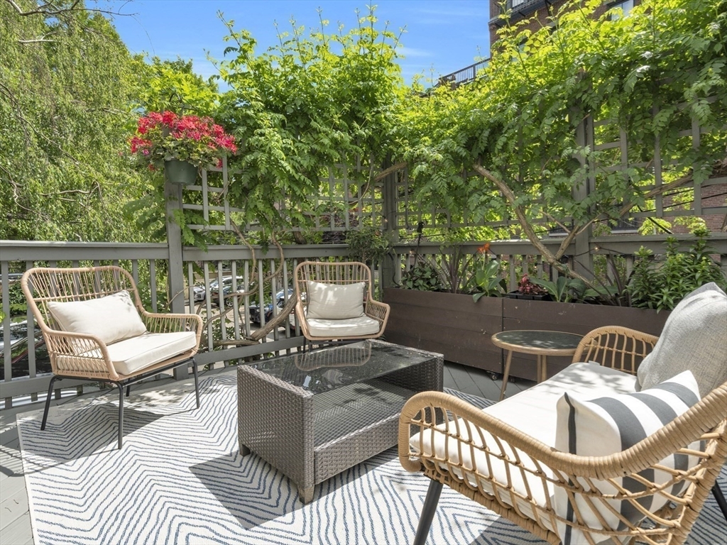 72 Rutland Street, Unit 1 Boston, MA 02118 - Photo 22 of 29 a view of a patio with couches chairs and a table and chairs
