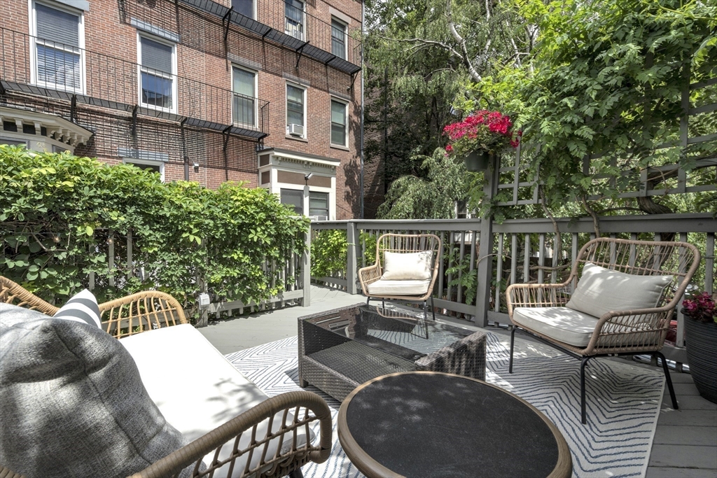 72 Rutland Street, Unit 1 Boston, MA 02118 - Photo 23 of 29 a view of a patio with couches table and chairs and potted plants