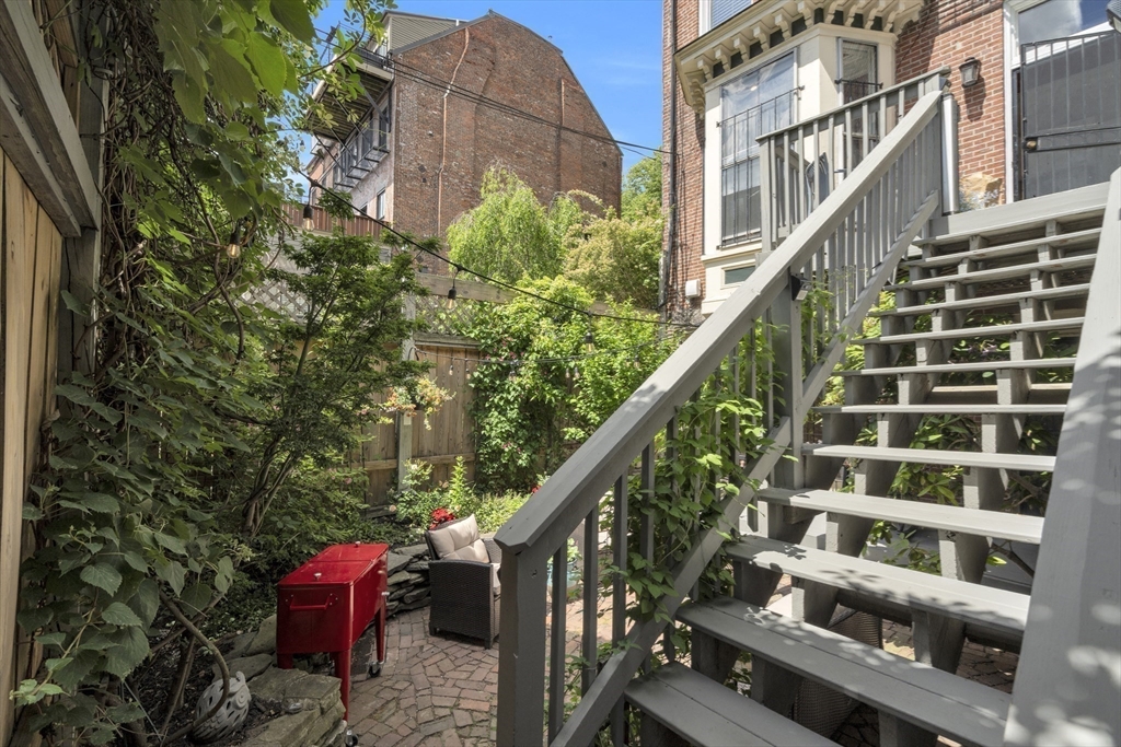 72 Rutland Street, Unit 1 Boston, MA 02118 - Photo 25 of 29 a view of building with yard and staircase