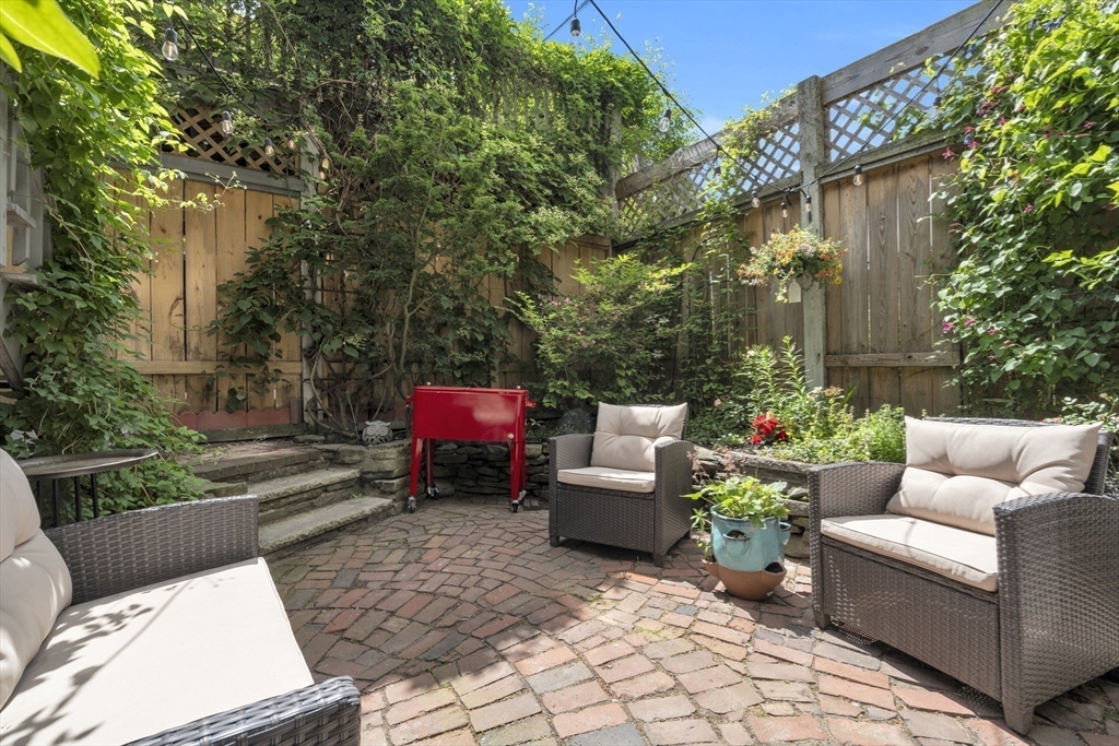 72 Rutland Street, Unit 1 Boston, MA 02118 - Photo 27 of 29 a view of a patio with couches and potted plants