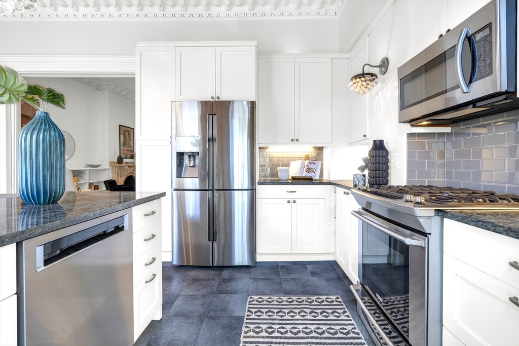 72 Rutland Street, Unit 1 Boston, MA 02118 - Photo 7 of 29 a kitchen with a sink stove and refrigerator