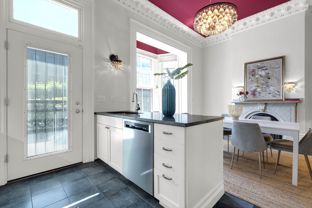 72 Rutland Street, Unit 1 Boston, MA 02118 - Photo 8 of 29 a very nice looking dining room with wooden floor and a chandelier