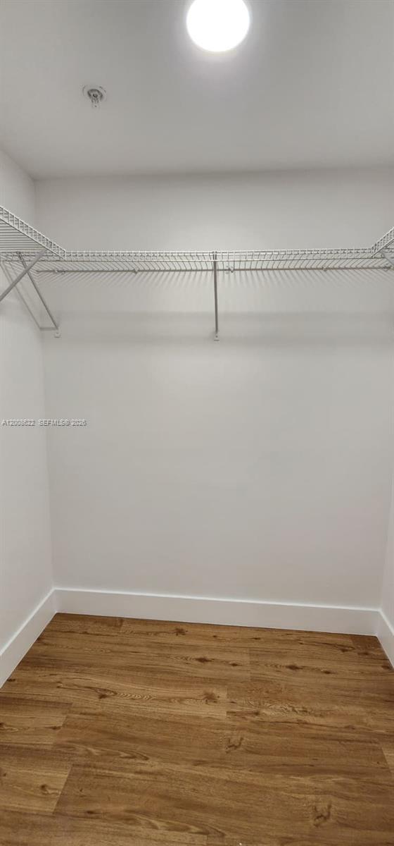 170 Southeast 14th Street, Unit 1408 Miami, FL 33131 - Photo 11 of 30 a view of a room with racks on the wall