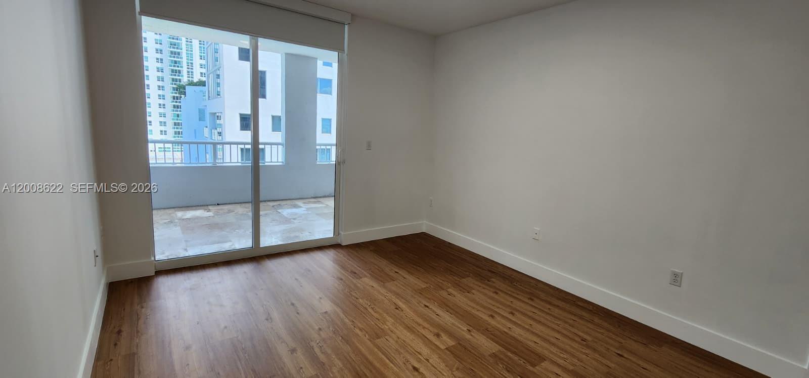 170 Southeast 14th Street, Unit 1408 Miami, FL 33131 - Photo 14 of 30 a view of wooden floor in a room