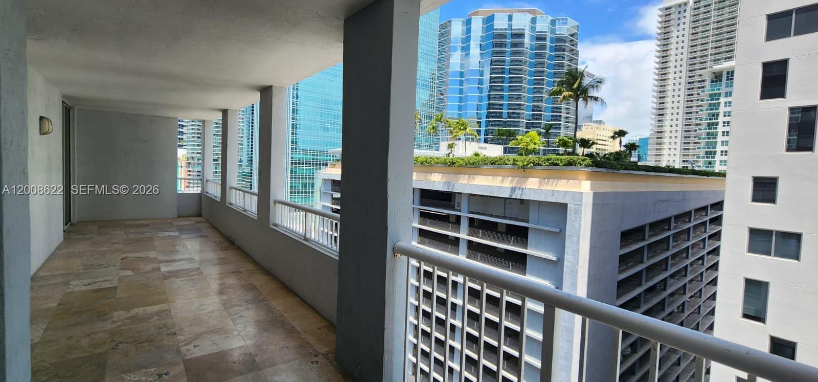 170 Southeast 14th Street, Unit 1408 Miami, FL 33131 - Photo 19 of 30 a view of balcony with wooden floor and fence