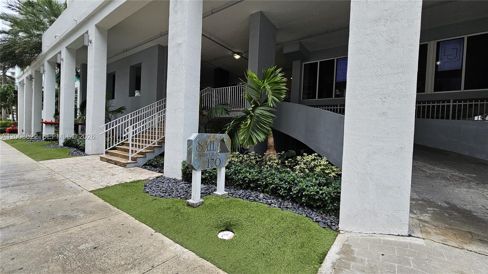 170 Southeast 14th Street, Unit 1408 Miami, FL 33131 - Photo 22 of 30 a front view of a house having yard