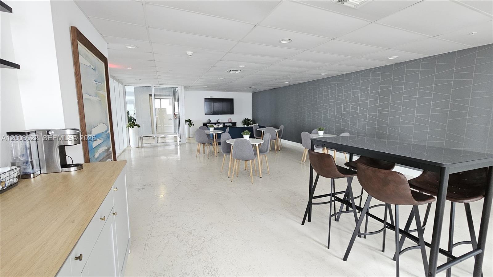 170 Southeast 14th Street, Unit 1408 Miami, FL 33131 - Photo 24 of 30 a dining room with furniture and a floor to ceiling window