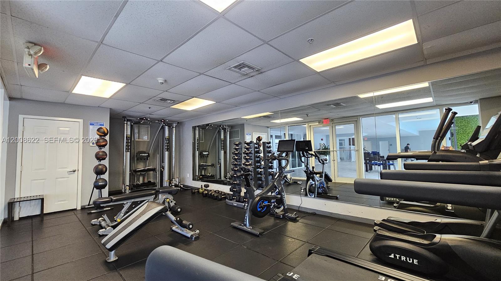170 Southeast 14th Street, Unit 1408 Miami, FL 33131 - Photo 26 of 30 a view of a room with gym equipment