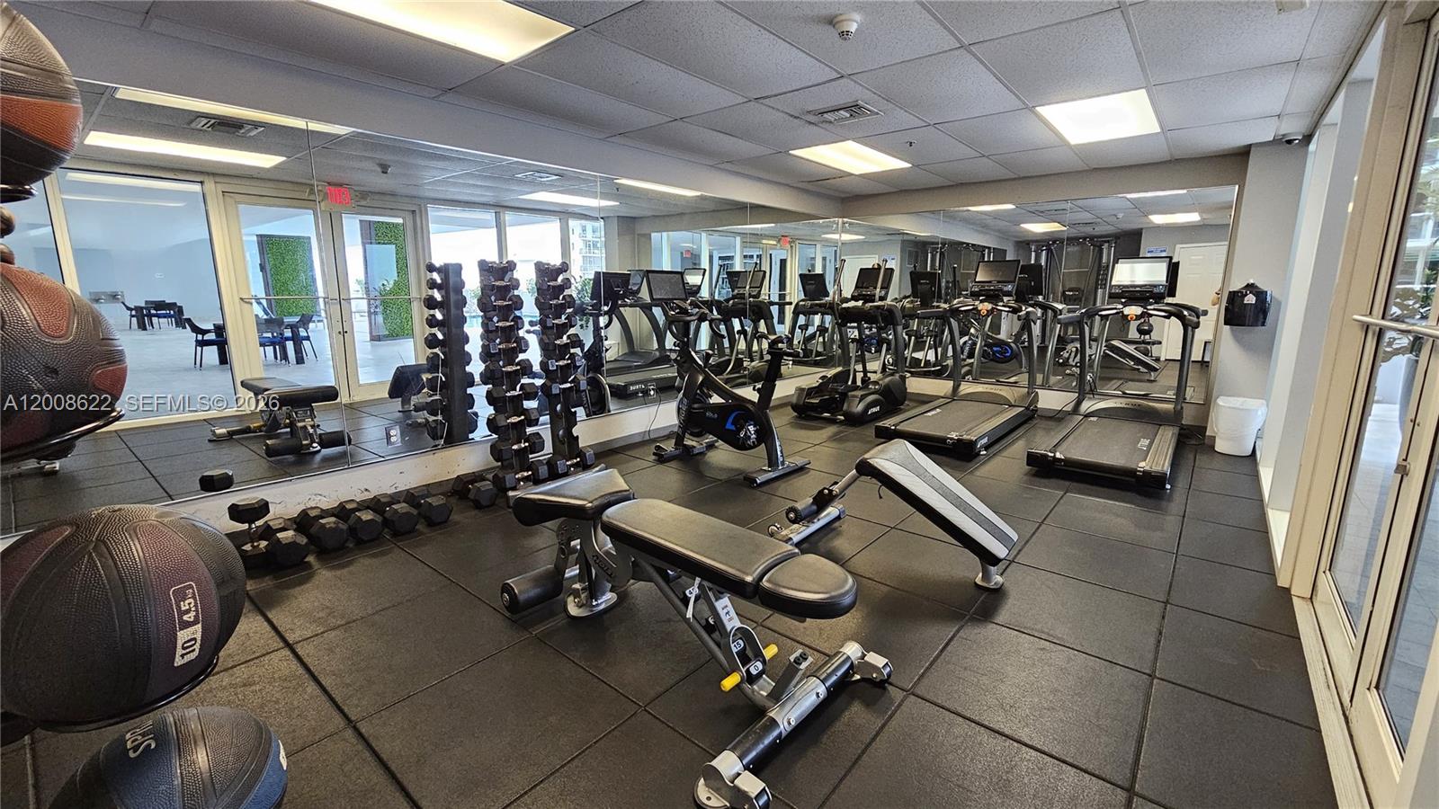170 Southeast 14th Street, Unit 1408 Miami, FL 33131 - Photo 27 of 30 a view of a room with gym equipment