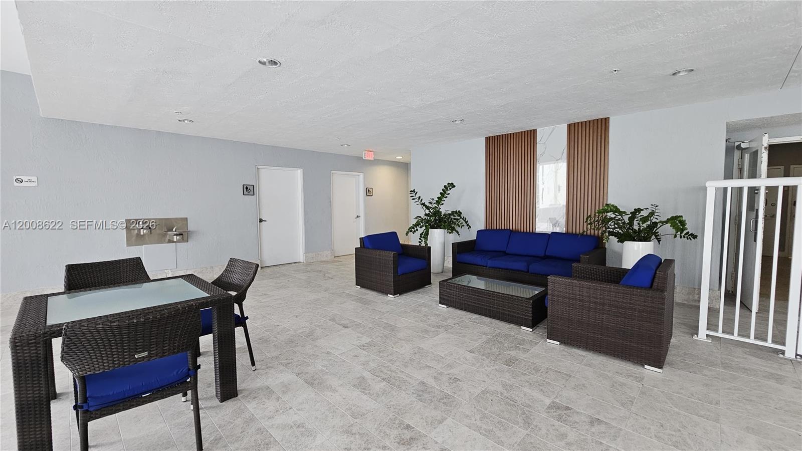 170 Southeast 14th Street, Unit 1408 Miami, FL 33131 - Photo 28 of 30 a living room with furniture and wooden floor