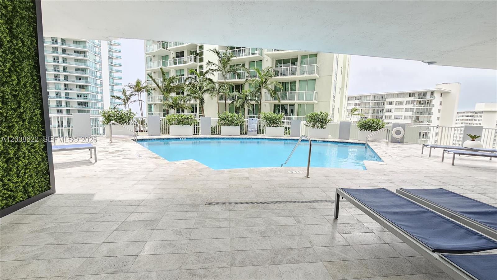 170 Southeast 14th Street, Unit 1408 Miami, FL 33131 - Photo 29 of 30 a living room filled with lots of furniture and a large window