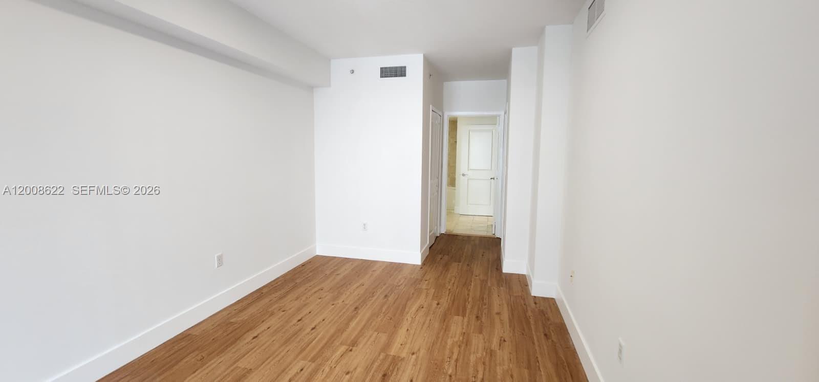 170 Southeast 14th Street, Unit 1408 Miami, FL 33131 - Photo 9 of 30 a view of a room with wooden floor