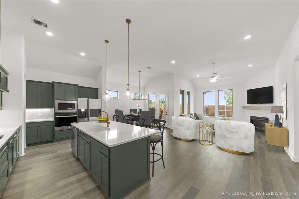 801 Stoney Bridge Way Lavon, TX 75166 - Photo 27 of 38 801 Stoney Bridge Way_Kitchen & Family Room Virtually Staged
