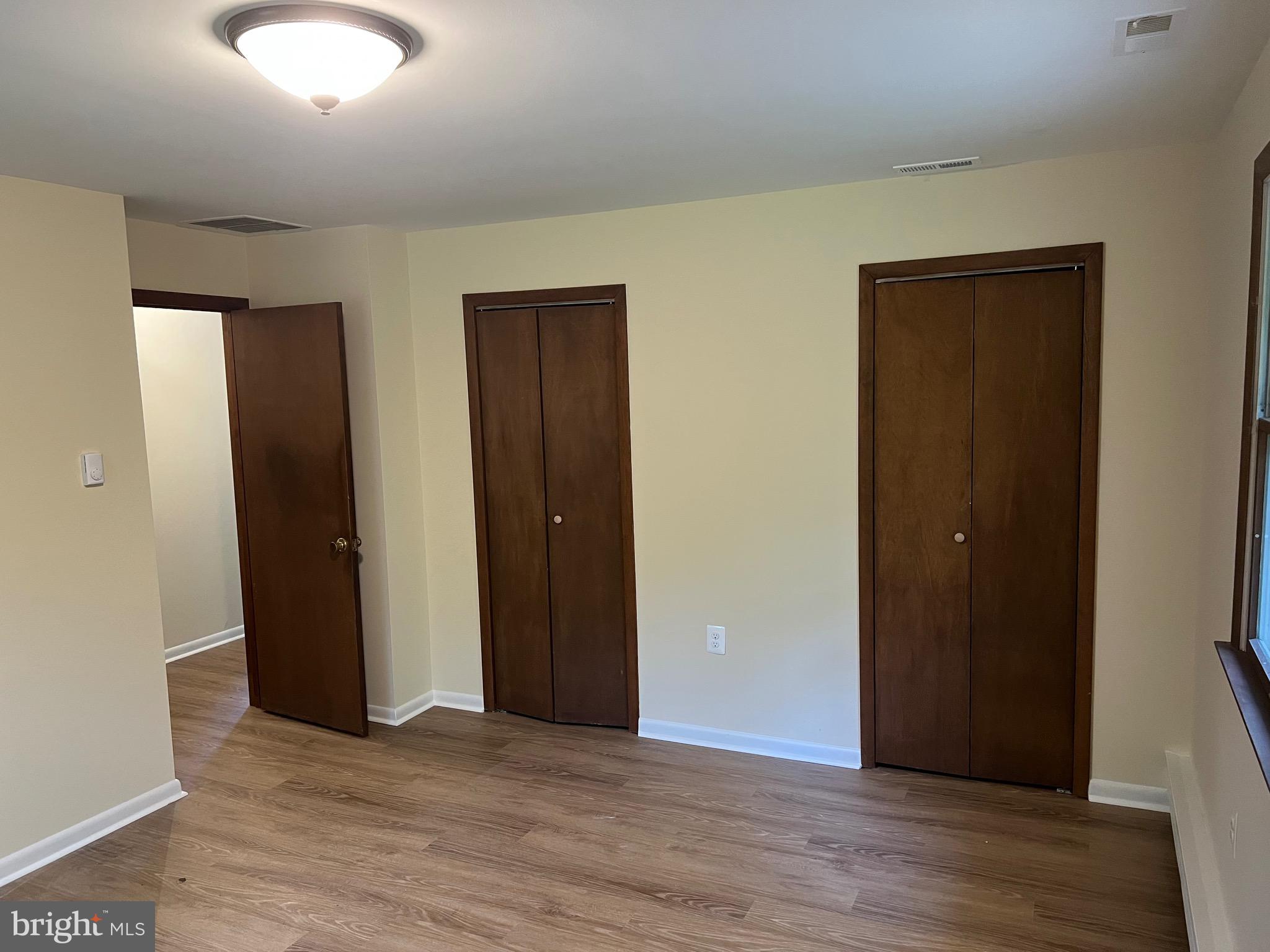 2617 Franklinville Road Joppa, MD 21085 - Photo 19 of 39 an empty room with wooden floor and closet