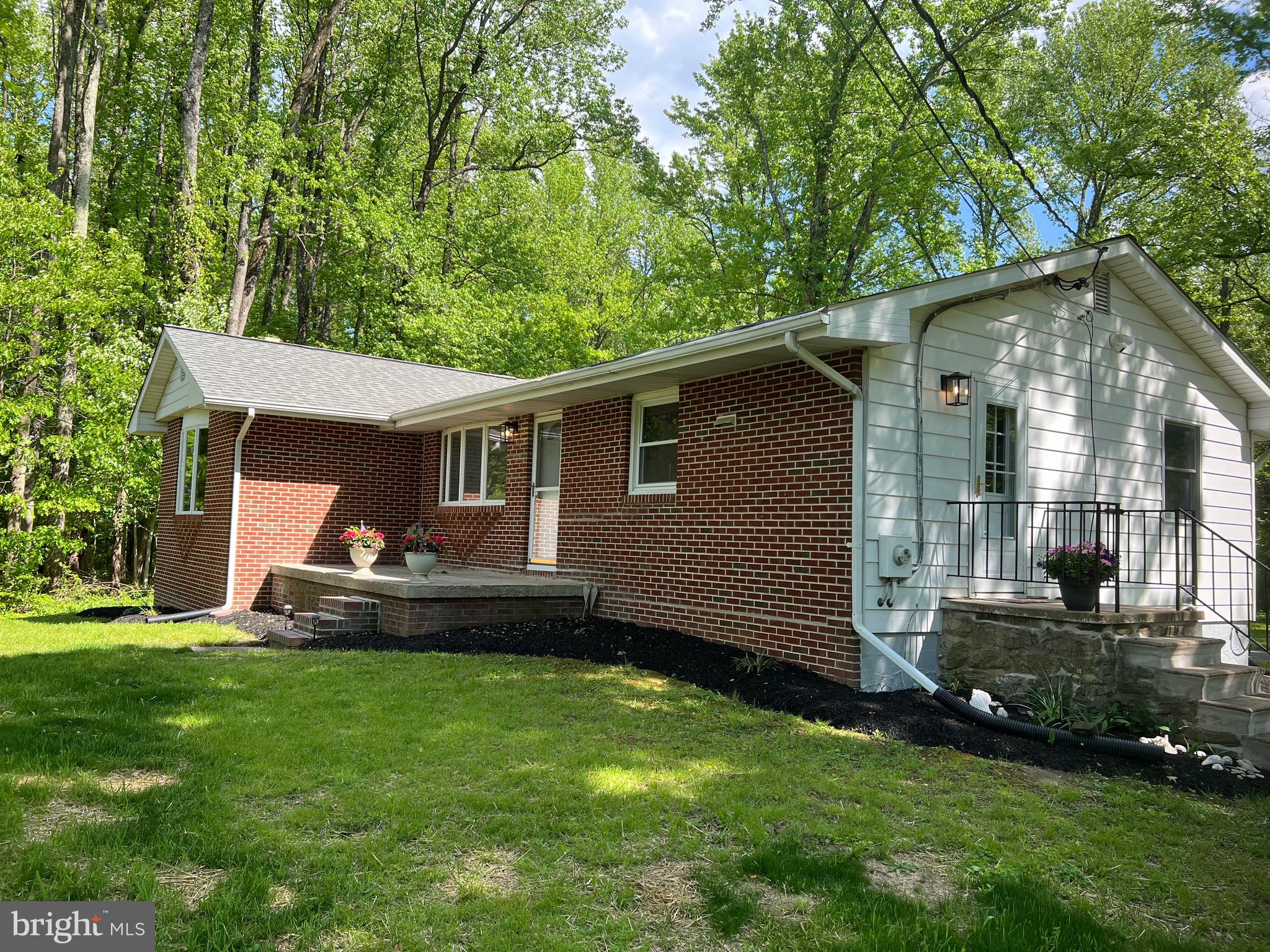 2617 Franklinville Road Joppa, MD 21085 - Photo 3 of 39 a front view of a house with a garden