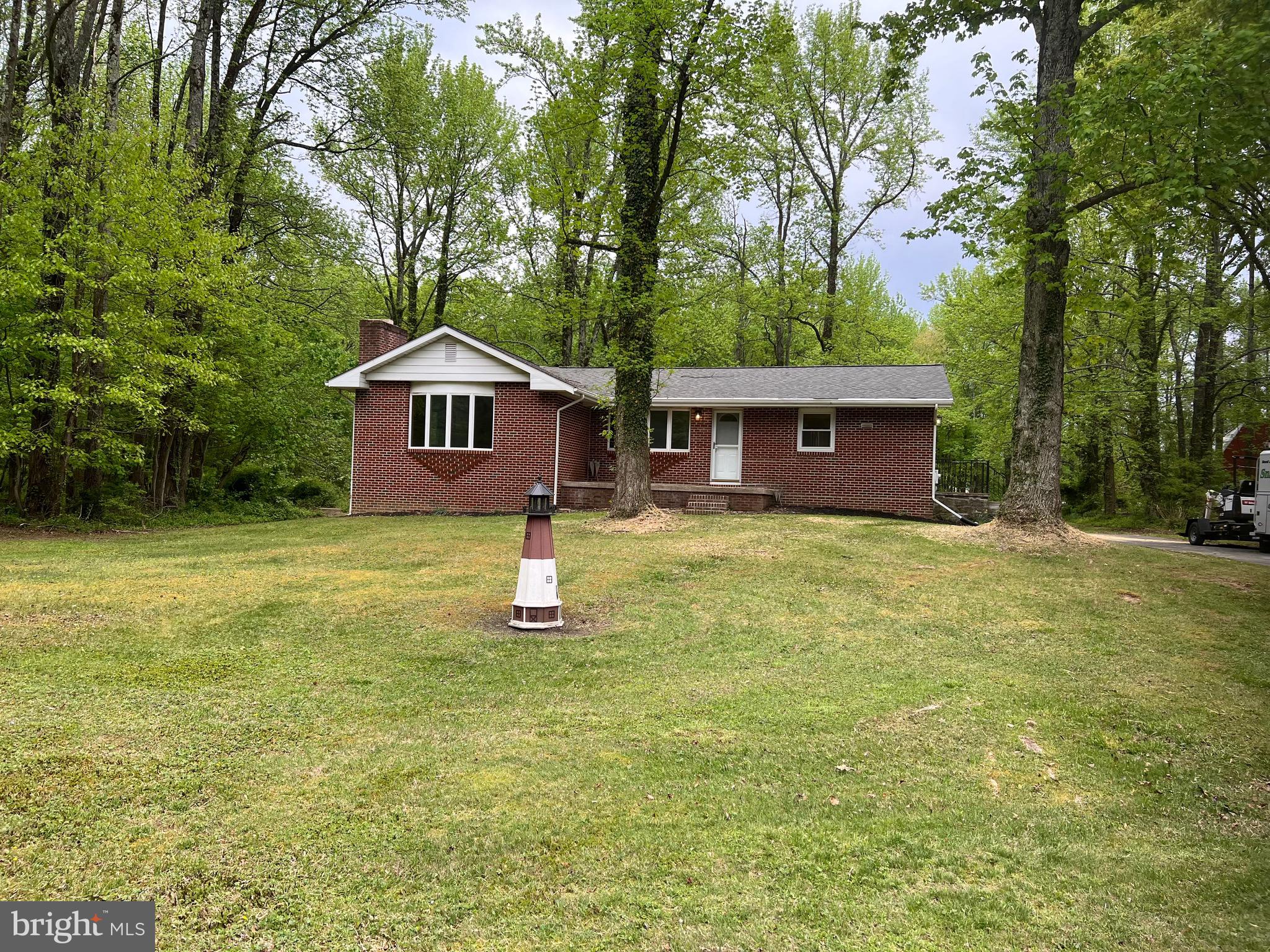 2617 Franklinville Road Joppa, MD 21085 - Photo 4 of 39 a front view of a house with yard and green space