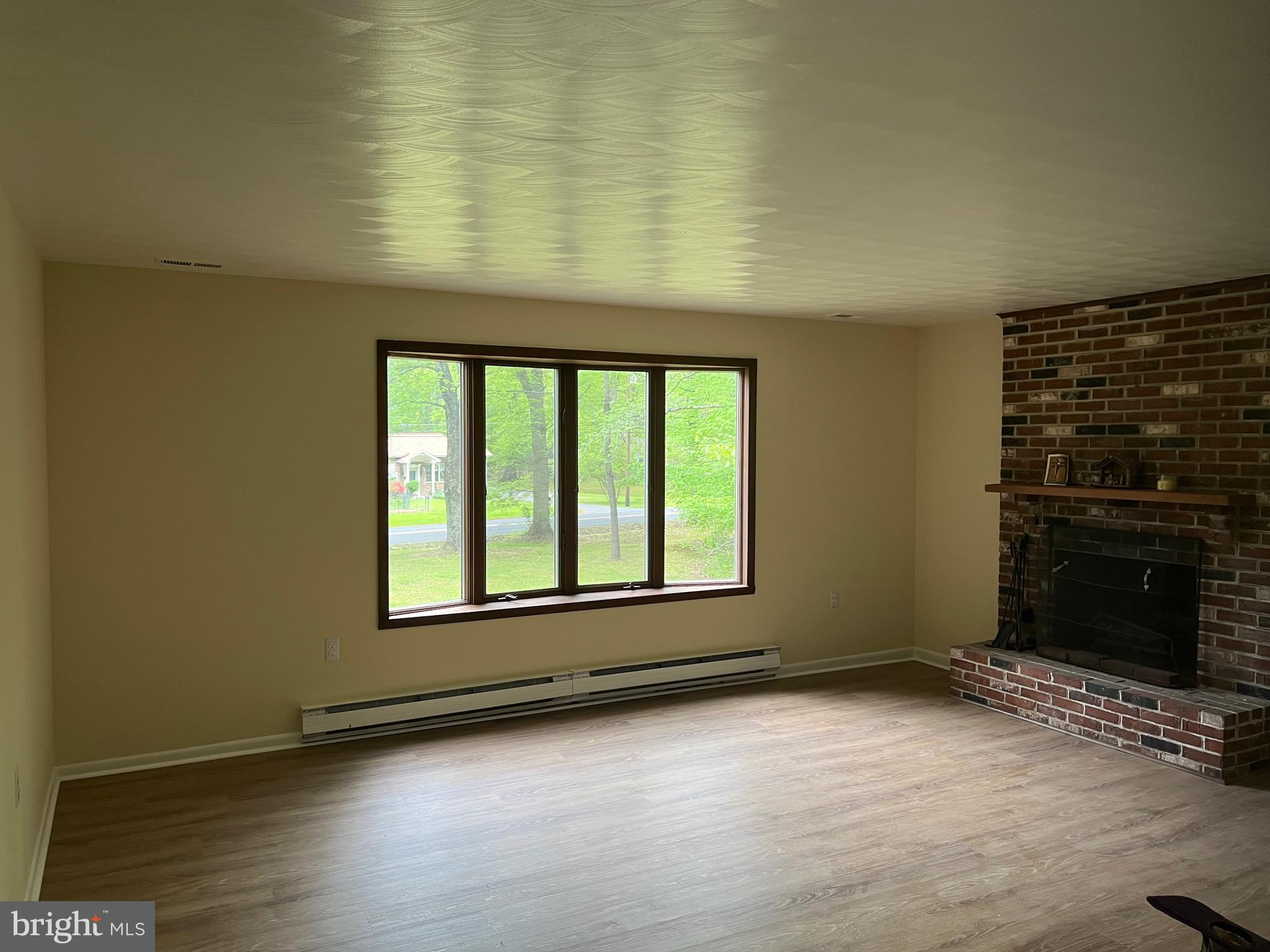 2617 Franklinville Road Joppa, MD 21085 - Photo 8 of 39 an empty room with wooden floor and windows