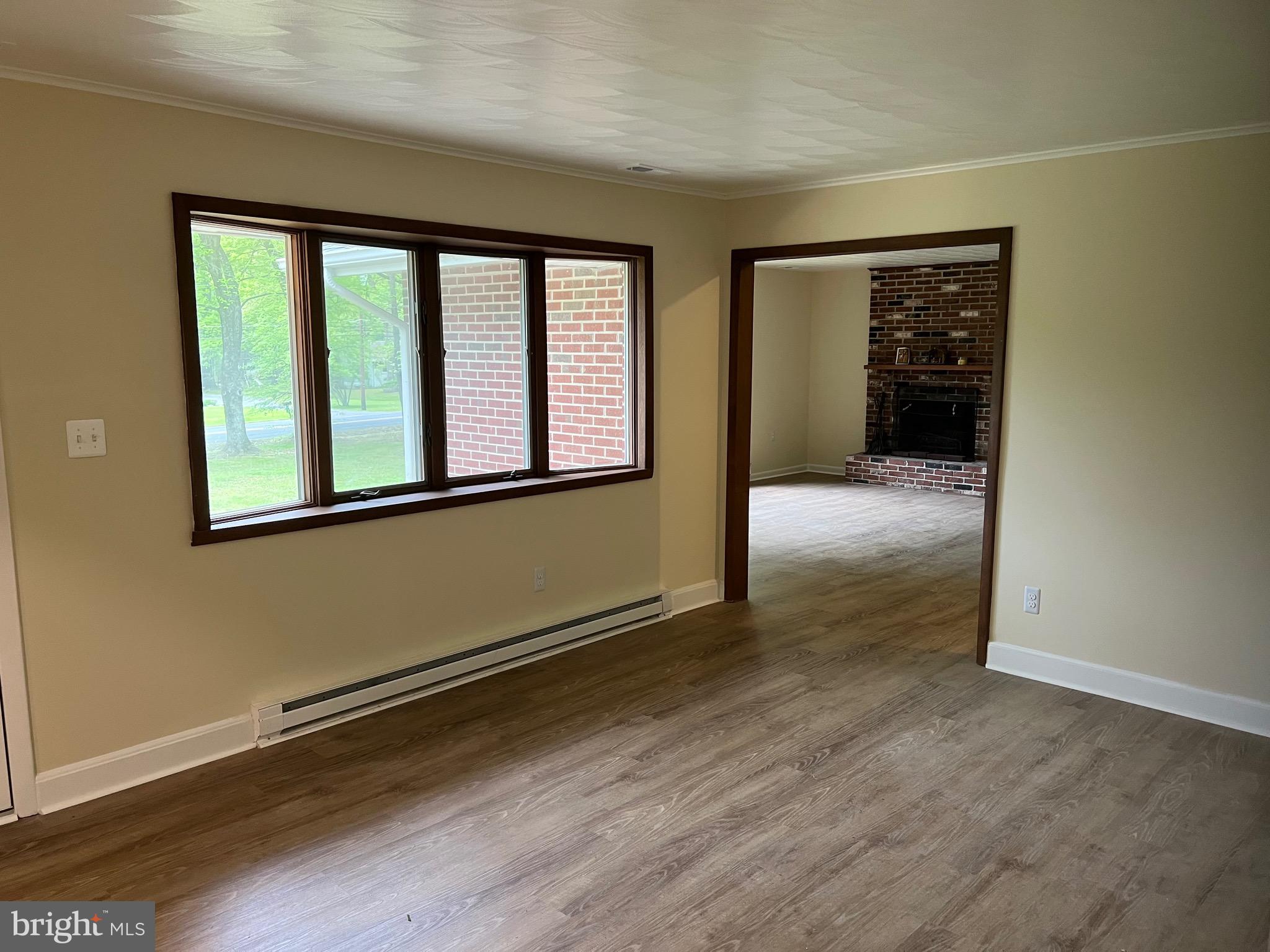 2617 Franklinville Road Joppa, MD 21085 - Photo 9 of 39 an empty room with wooden floor and windows