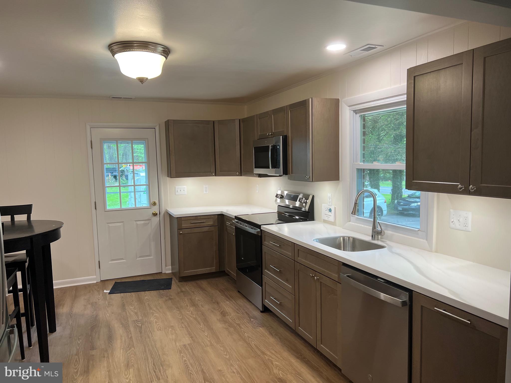 2617 Franklinville Road Joppa, MD 21085 - Photo 10 of 39 a kitchen with a sink cabinets and window