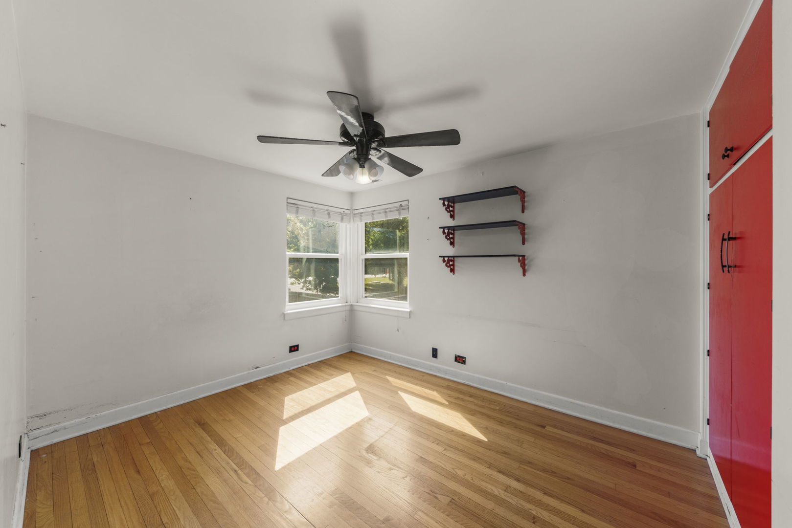 8119 Edgewater Road North Riverside, IL 60546 - Photo 11 of 26 a view of empty room with wooden floor and fan