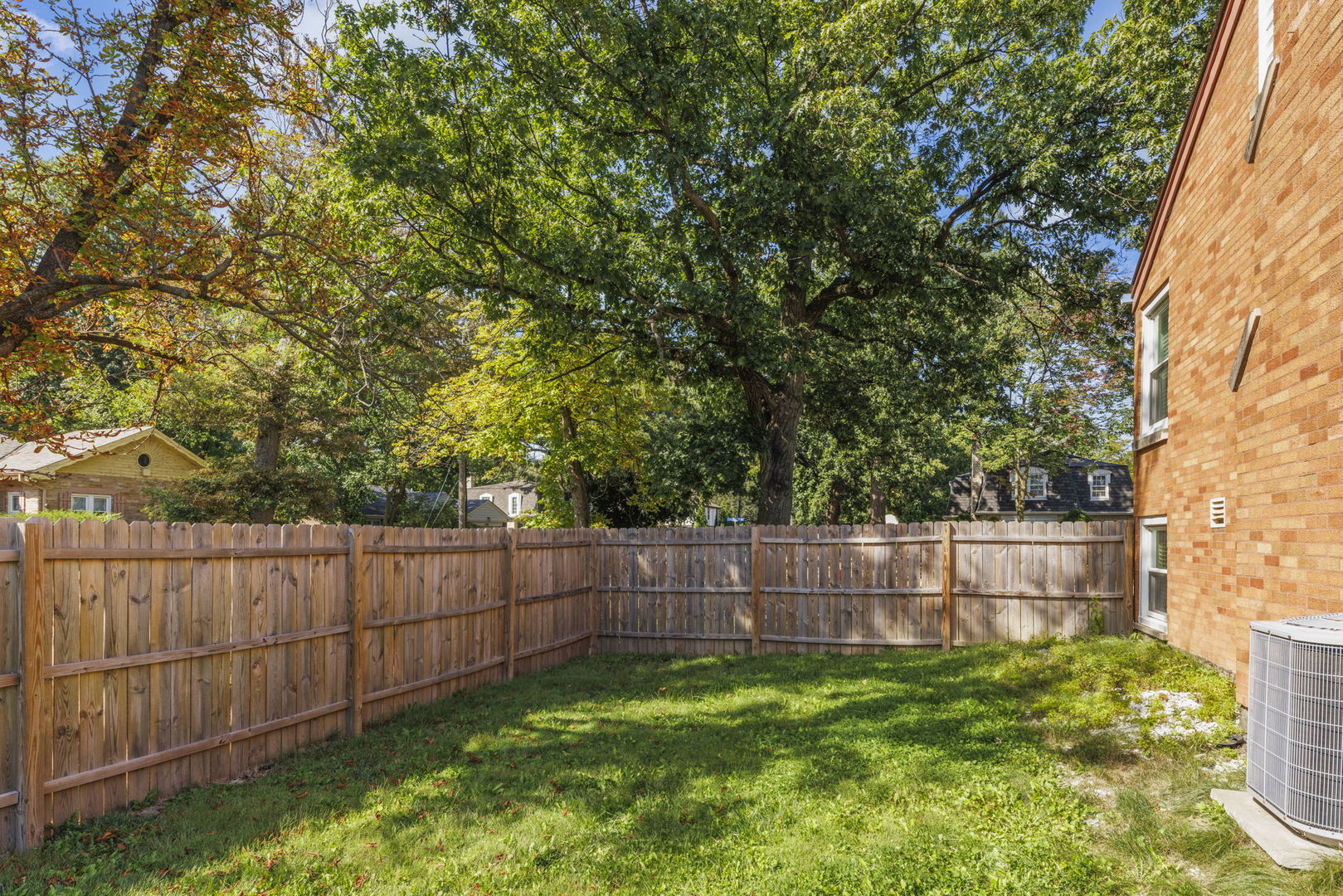 8119 Edgewater Road North Riverside, IL 60546 - Photo 19 of 26 a view of backyard with wooden fence and large trees