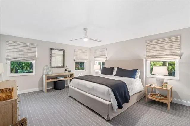 a large white bed in a white room