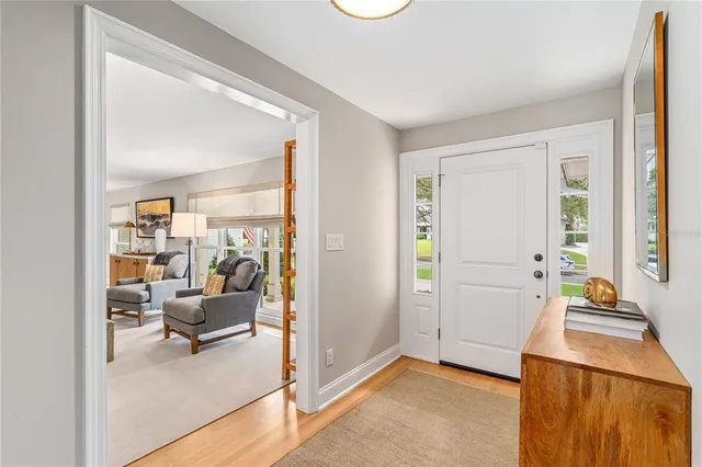 a view of a livingroom with furniture and windows