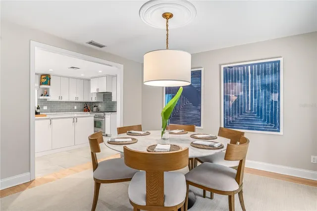 a view of a dining room with furniture and window