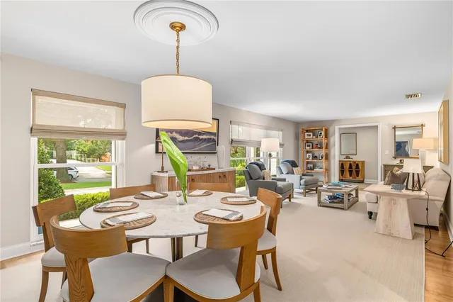 a view of a dining room with furniture window and outside view