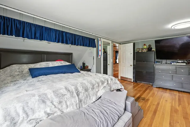 a room with furniture a chandelier and a window