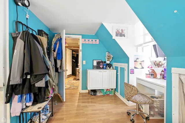 a kitchen with white cabinets and appliances