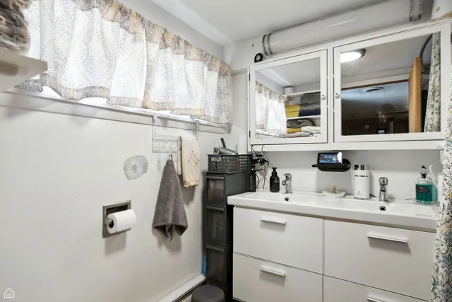 a kitchen with a refrigerator stove and sink