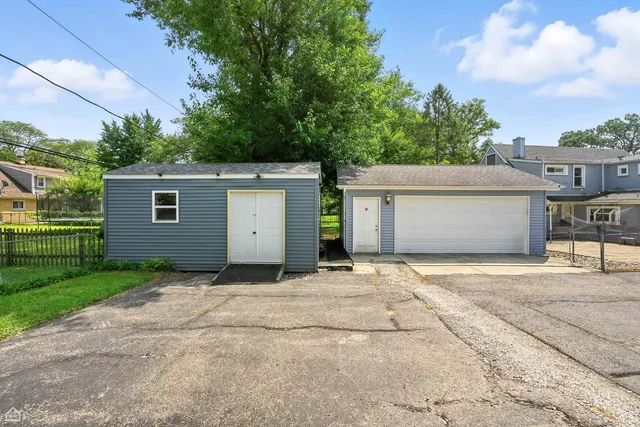 a bedroom with a bed and a table in it