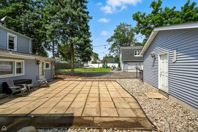 a view of balcony with wooden floor and fence