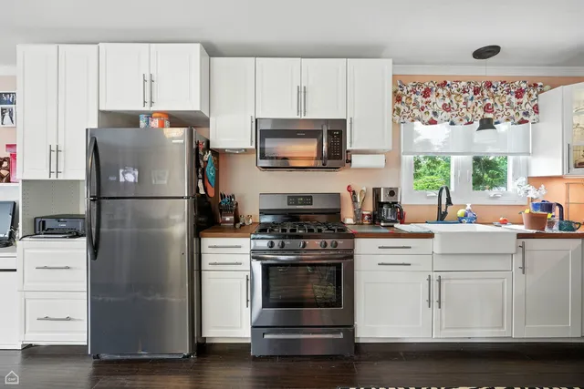 a view of a house with a yard porch and sitting area