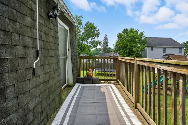 a front view of a house with yard and green space