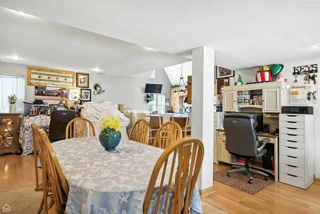 a view of a livingroom with furniture and stairs