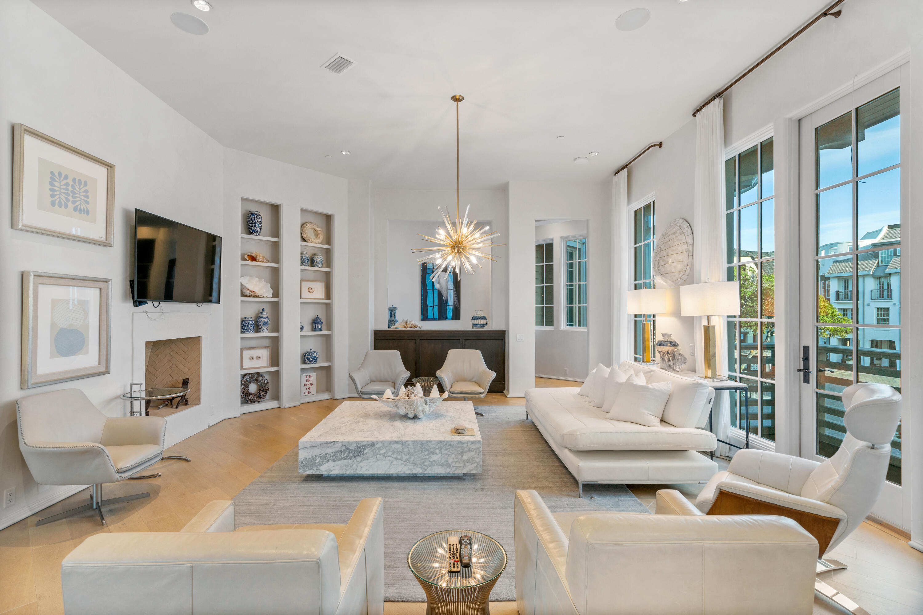 16 South Barrett Square, Unit 5 Rosemary Beach, FL 32461 - Photo 11 of 100 a living room with furniture a fireplace and a flat screen tv